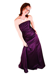 Image showing Young pretty girl standing in burgundy evening dress.