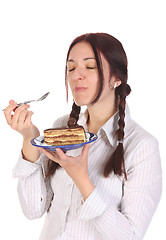 Image showing Beautiful woman eating piece of cake