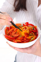 Image showing chopsticks, bowl and peppers