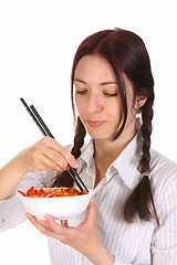 Image showing Beautiful woman eating with chopsticks