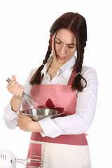 Image showing tired housewife preparing with egg beater