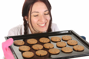 Image showing beautiful housewife smelling of cakes 