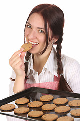 Image showing housewife eating a slice of chocolate cake 