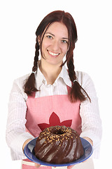 Image showing housewife showing off bundt cake