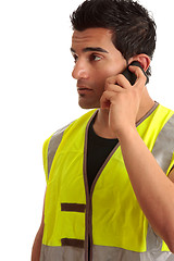 Image showing Tradesman handyman on the phone