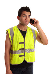Image showing Builder tradesman takes a call
