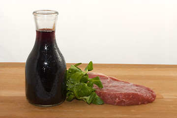 Image showing Raw beef and wine