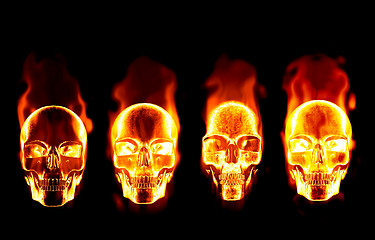 Image showing four flaming skulls on black