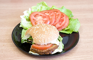 Image showing bite of burger