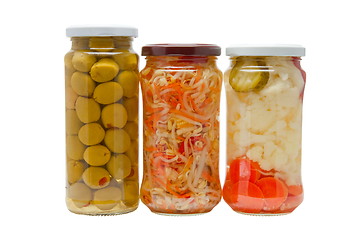 Image showing Glass jars with marinated vegetables  isolated on the white back