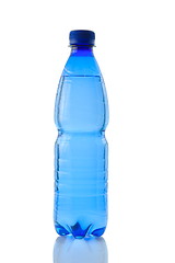 Image showing A bottle of mineral water reflected on white background