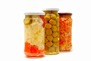 Image showing Glass jars with marinated vegetables  isolated on the white back