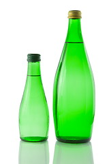 Image showing Bottles  of mineral water reflected on white background