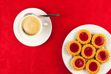 Image showing Coffee and cookies on a red background