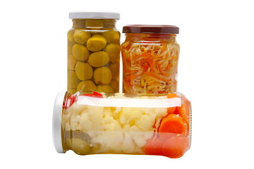 Image showing Glass jars with marinated vegetables  isolated on the white back