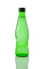 Image showing A bottle of mineral water reflected on white background