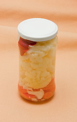 Image showing Glas jars with marinated vegetables  isolated on the white backg