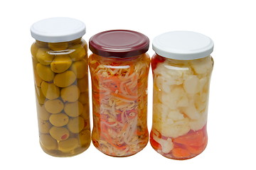 Image showing Glass jars with marinated vegetables  isolated on the white back