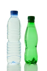 Image showing Bottles  of mineral water reflected on white background