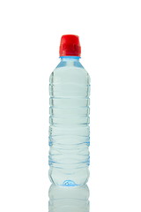 Image showing A bottle of mineral water reflected on white background