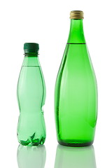 Image showing Bottles  of mineral water reflected on white background