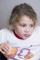 Image showing little girl having a sandwich