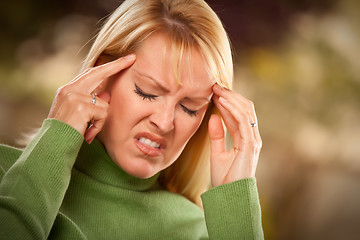 Image showing Grimacing Woman Suffering a Headache