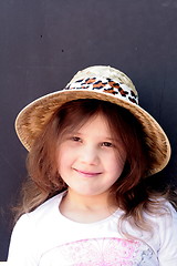 Image showing Young girl in big brimmed hat