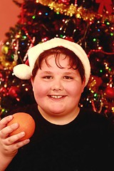 Image showing Young boy at Christmas with santa hat