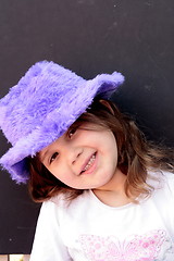 Image showing Pretty girl in purple hat