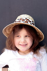 Image showing Young girl in big brimmed hat