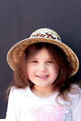 Image showing Young girl in big brimmed hat