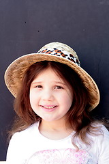 Image showing Young girl in big brimmed hat