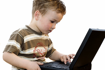 Image showing Boy working on a laptop