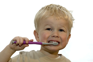 Image showing Kid brushing teeth