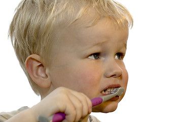 Image showing Kid brushing teeth