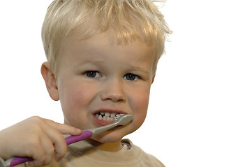 Image showing Kid brushing teeth