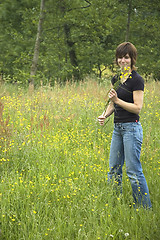 Image showing Beautiful girl picking flowers