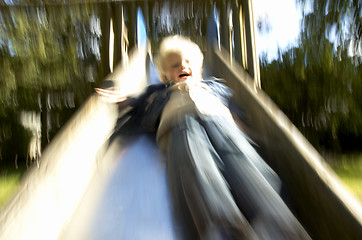 Image showing Boy down the slide