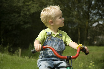 Image showing Little kid on bike