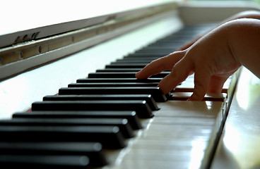 Image showing Child playing the piano