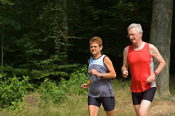 Image showing senior couple running