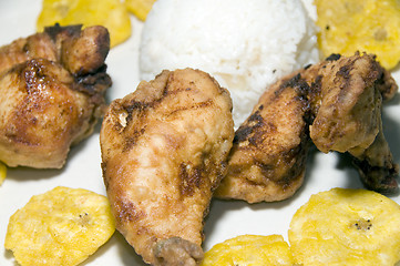 Image showing fried chicken tostones and white rice