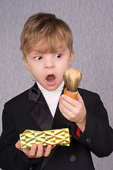 Image showing Boy and gift box and shaving brush