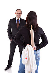 Image showing woman waiting for her husband, with the rolling pin and a white shirt with lipstick mark hidden behind his back