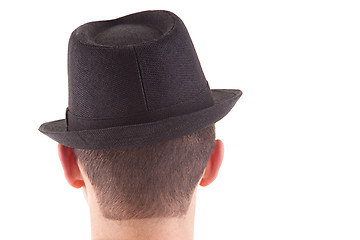 Image showing man on his back with a black hat on