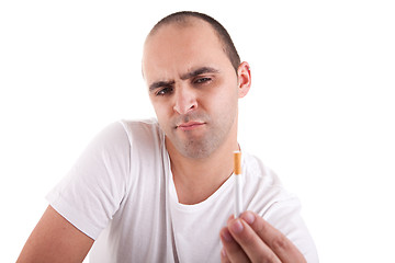 Image showing man torn between smoking and not smoking