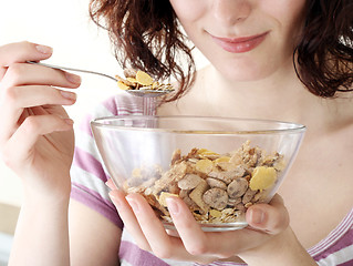 Image showing Young people eating milk with cereals