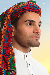 Image showing Arab man looks out expectantly