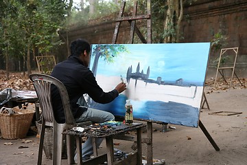 Image showing Cambodian painter painting Angkor Wat